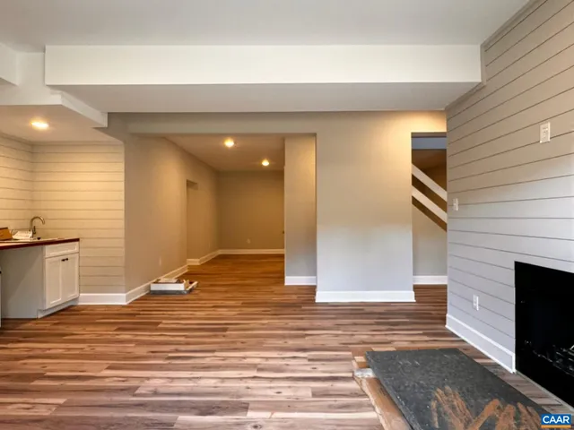 a view of wooden floor in a hallway