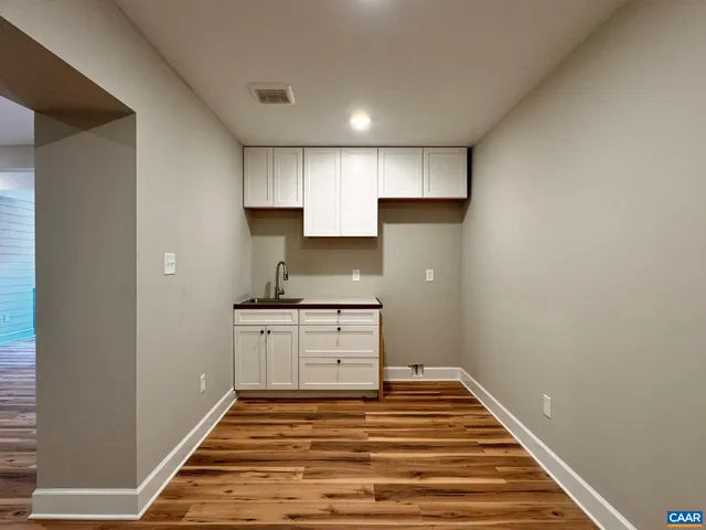 a view of bedroom with wooden floor