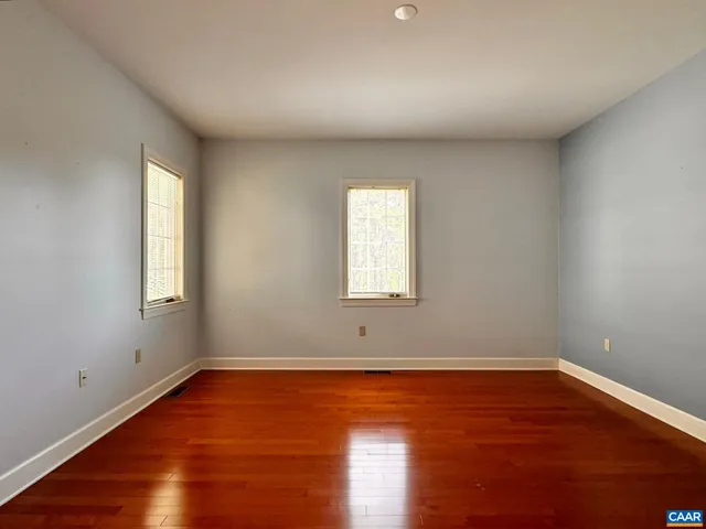 a bathroom with a toilet and bathtub