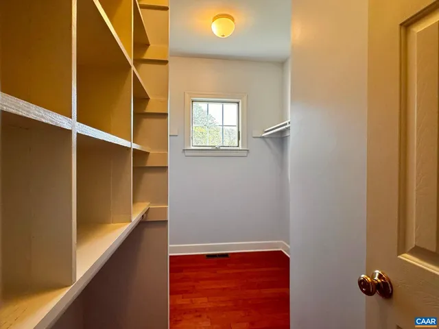 a view of room with wooden floor