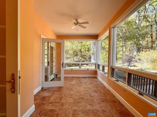 a kitchen with stainless steel appliances granite countertop a refrigerator a stove and a sink with wooden floor