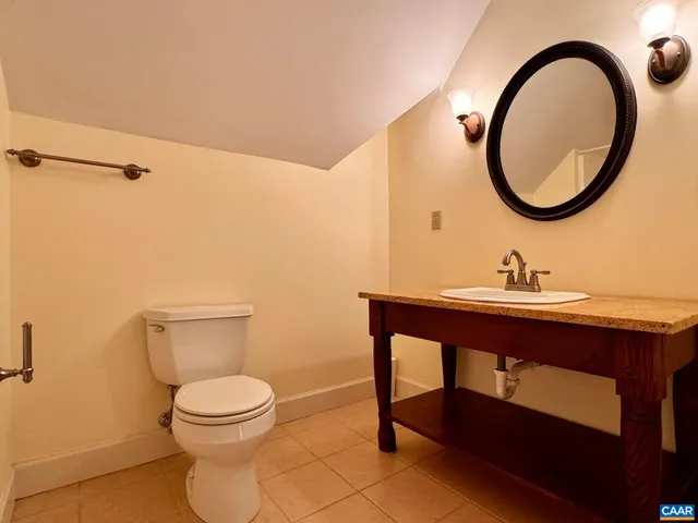 a view of room with window and wooden floor