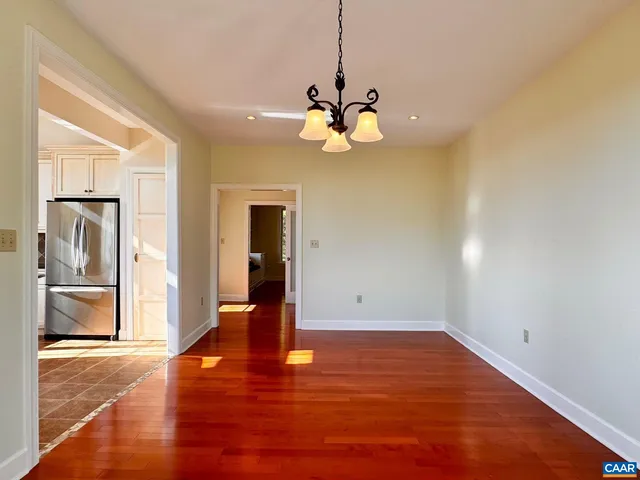 a bathroom with a sink toilet a mirror and shower
