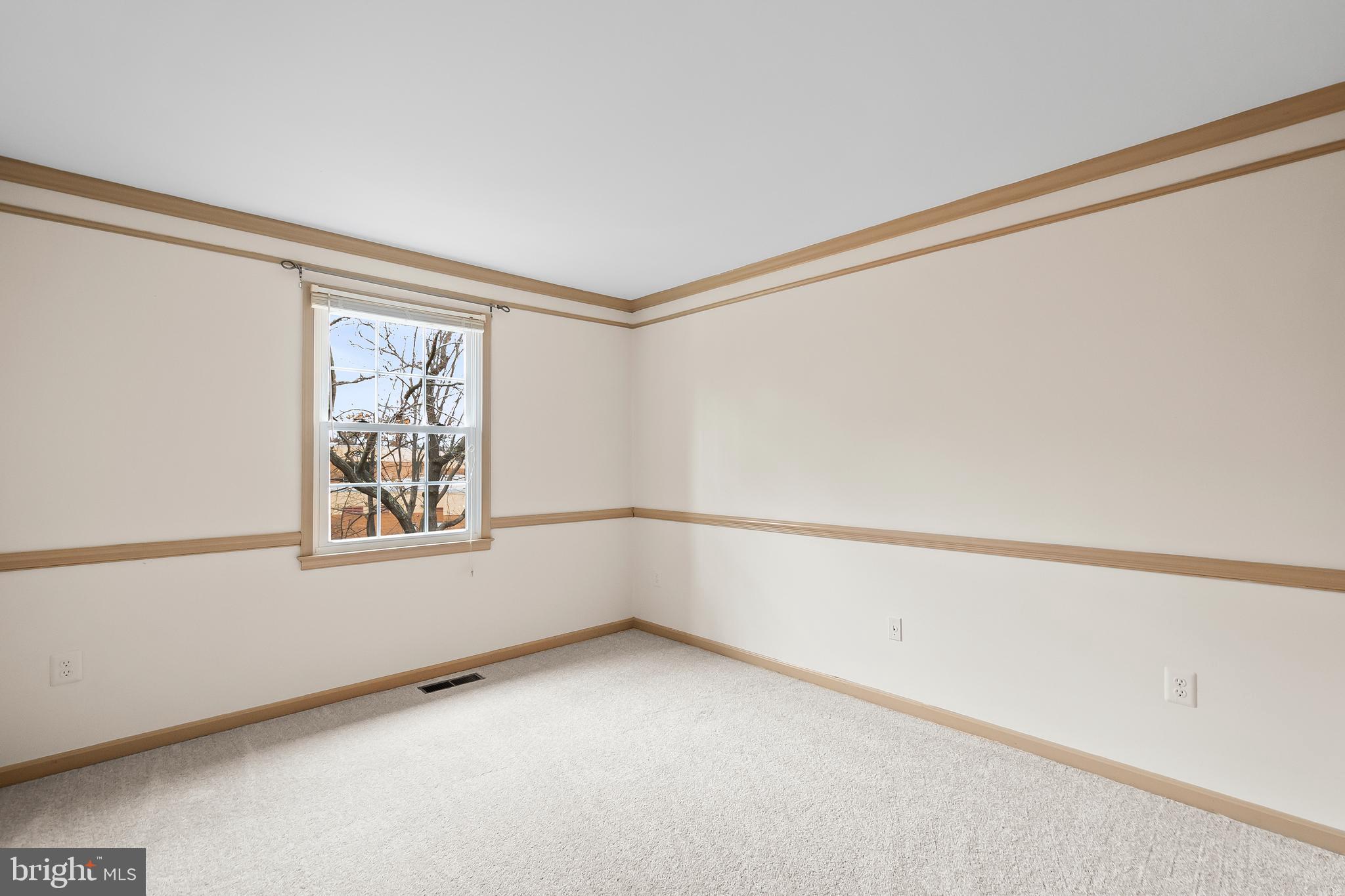 9518 Hunt Square Court Springfield, VA 22153 - Photo 20 of 39 a view of an empty room with a window