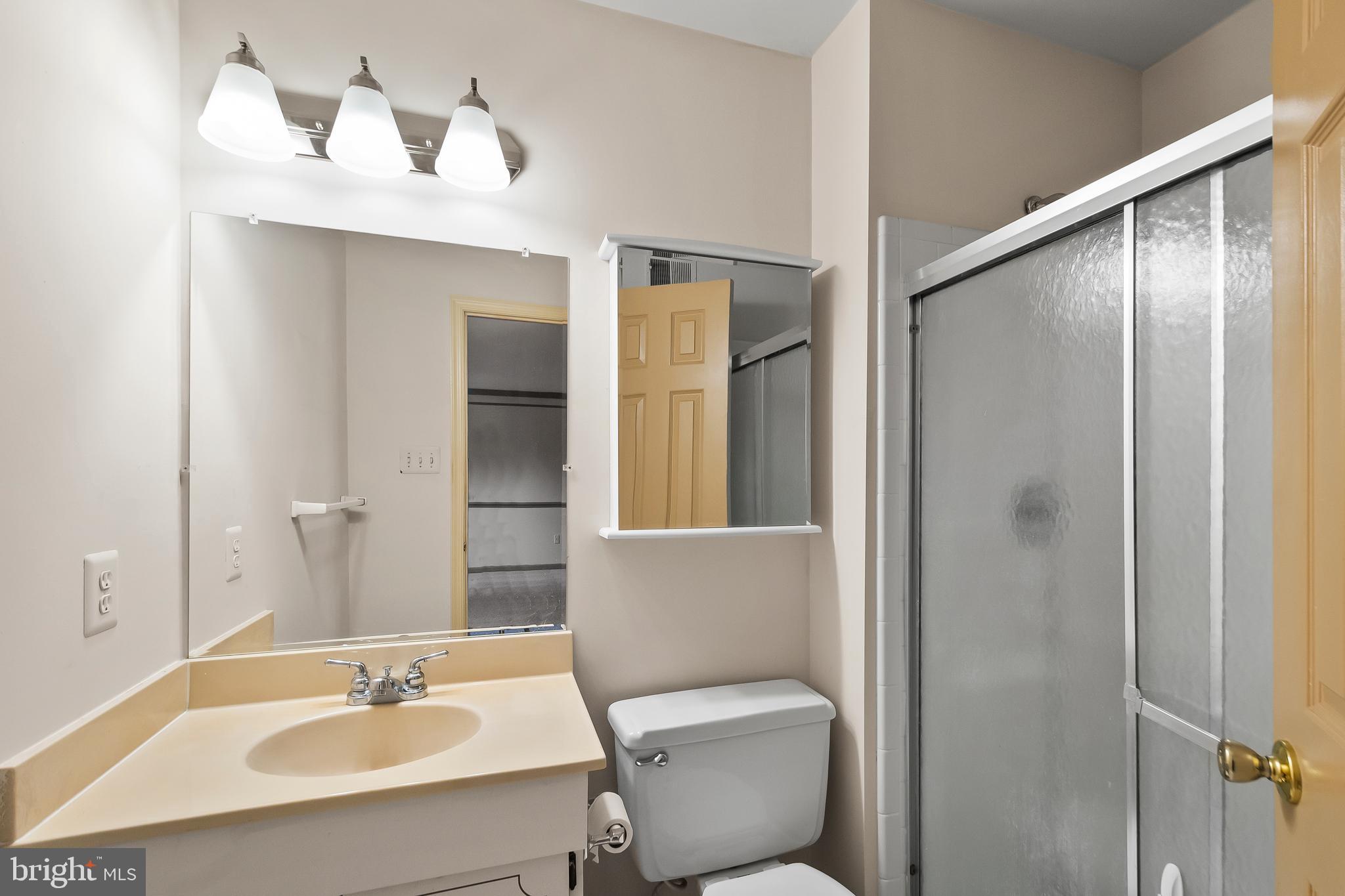 9518 Hunt Square Court Springfield, VA 22153 - Photo 29 of 39 a bathroom with a sink toilet and shower