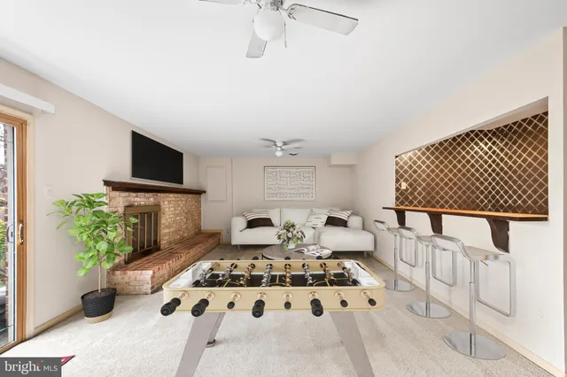 a living room with furniture fireplace and flat screen tv