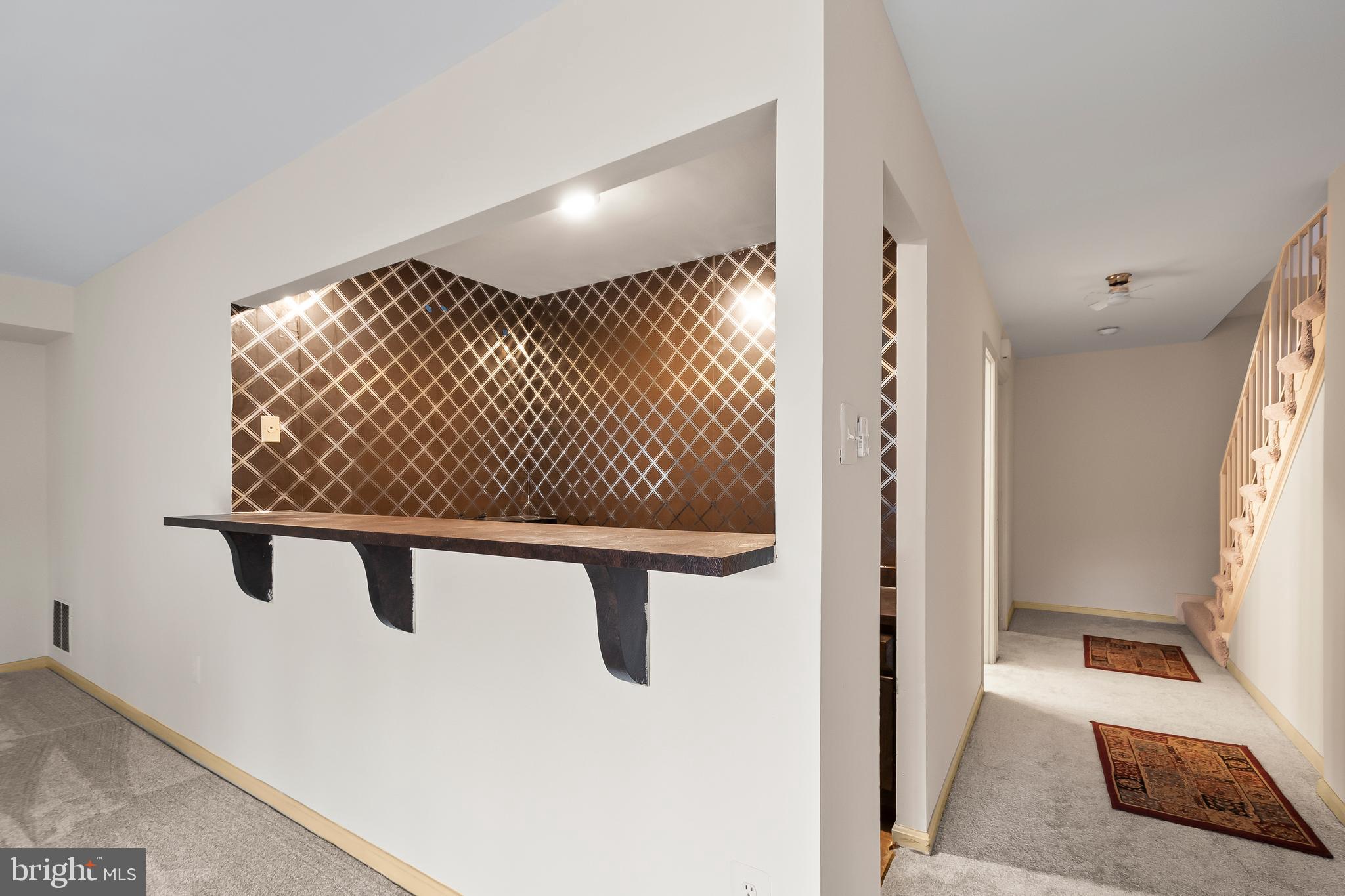 9518 Hunt Square Court Springfield, VA 22153 - Photo 34 of 39 a view of a room with wooden floor and windows