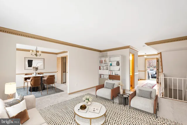 a living room with furniture a rug and a table