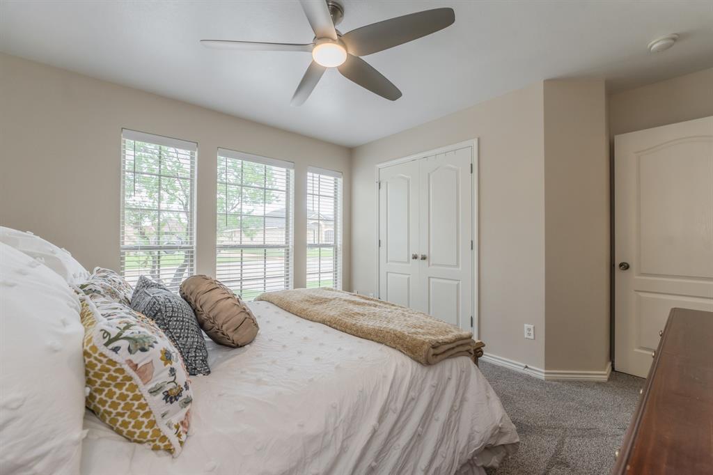6027 Oakmont Drive Wichita Falls, TX 76310 - Photo 11 of 40 a bedroom with a bed and a large window
