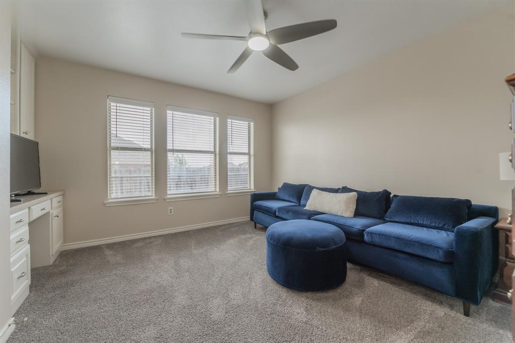 6027 Oakmont Drive Wichita Falls, TX 76310 - Photo 14 of 40 a living room with furniture and a flat screen tv