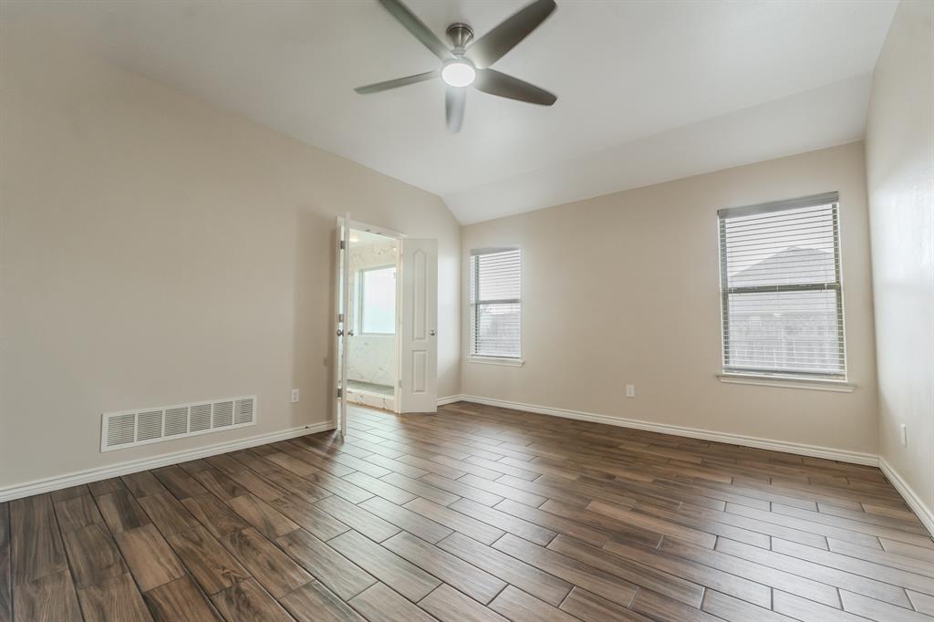 6027 Oakmont Drive Wichita Falls, TX 76310 - Photo 27 of 40 an empty room with wooden floor closet and windows