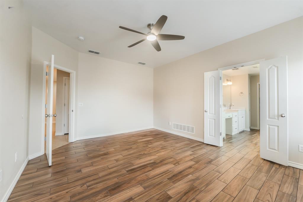 6027 Oakmont Drive Wichita Falls, TX 76310 - Photo 30 of 40 a view of an empty room and wooden floor