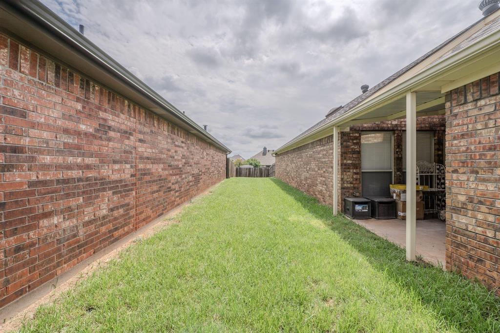 6027 Oakmont Drive Wichita Falls, TX 76310 - Photo 38 of 40 a backyard of a house with barbeque oven