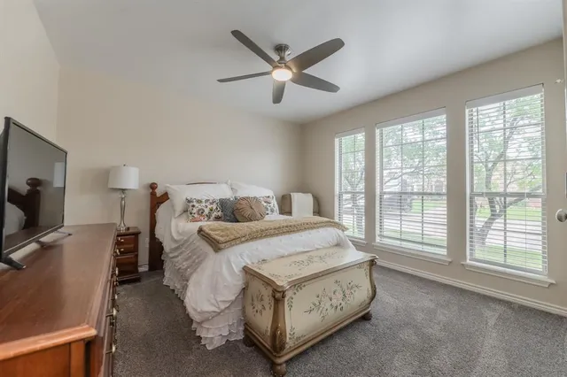 a living room with furniture and flat screen tv