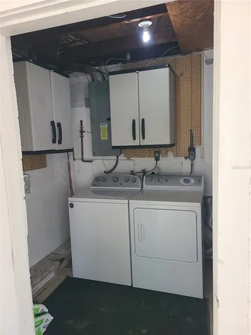 a sink with white cabinets