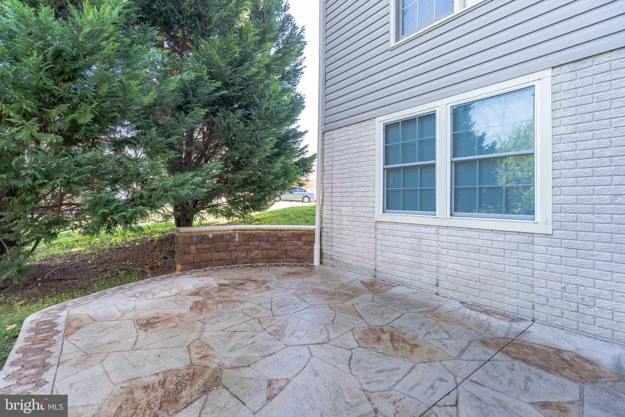 18606 Kerill Road Triangle, VA 22172 - Photo 44 of 50 Stamped concrete patio extends to edge of home