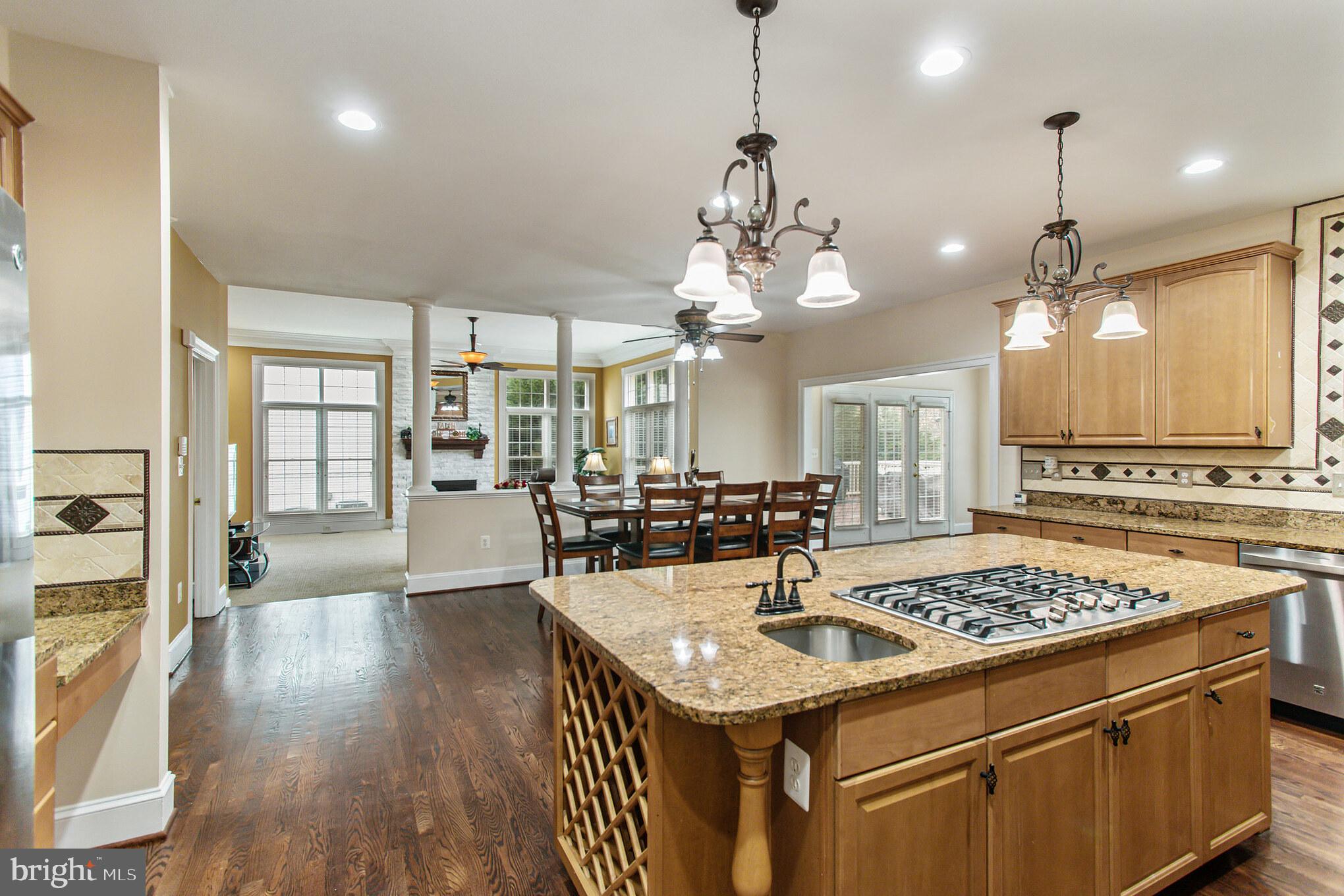 18606 Kerill Road Triangle, VA 22172 - Photo 7 of 50 Cooktop and sink in island; built-in wine rack