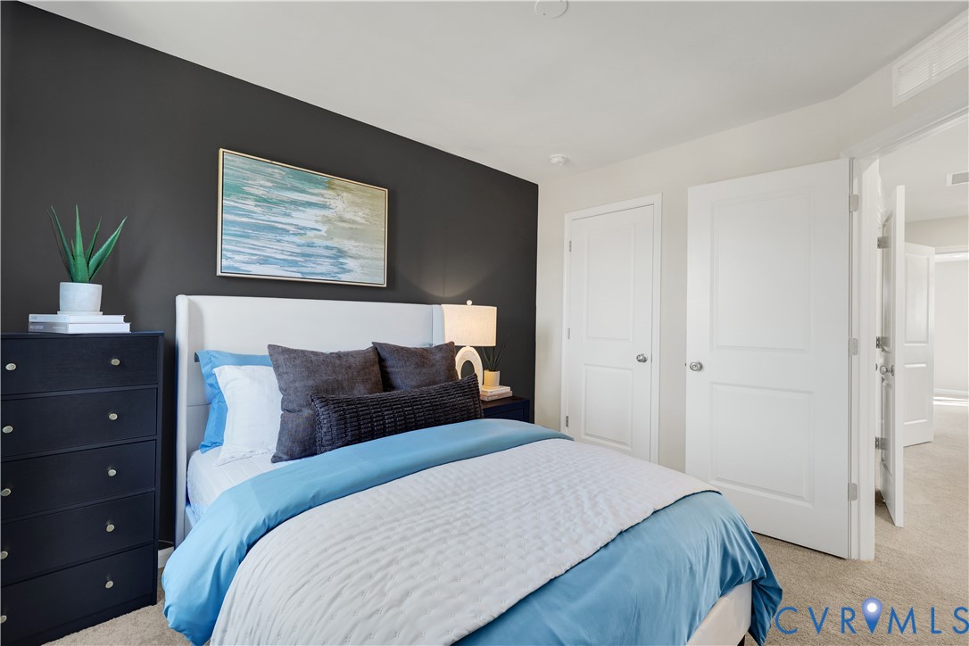 6119 Primrose Path Road Richmond, VA 23225 - Photo 11 of 27 a bedroom with a bed and a painting on the wall