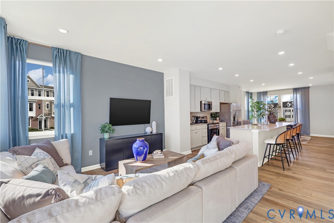 6119 Primrose Path Road Richmond, VA 23225 - Photo 8 of 27 a living room with furniture and a flat screen tv