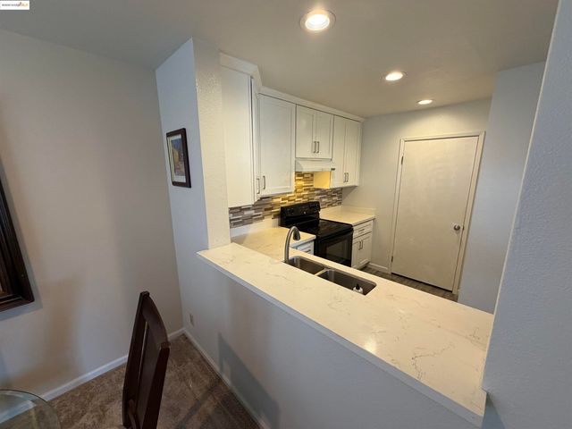 a view of a dining room with furniture and window