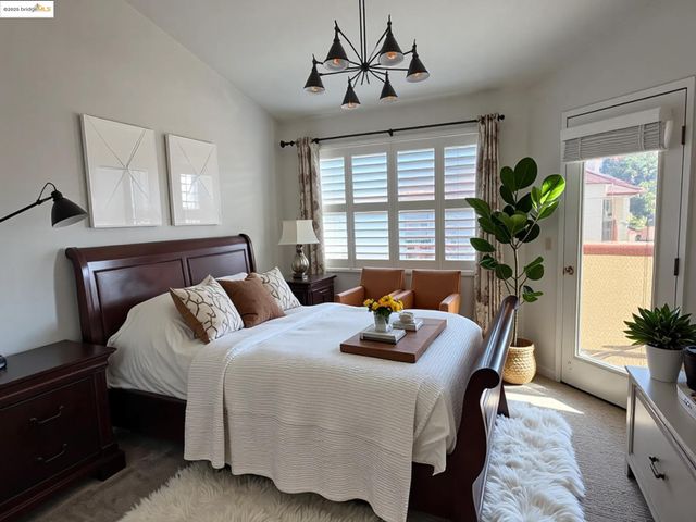 a bedroom with a bed and a potted plant