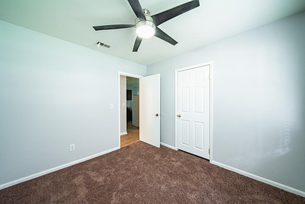 4 Clausen Drive Columbus, GA 31907 - Photo 19 of 27 an empty room with chandelier fan