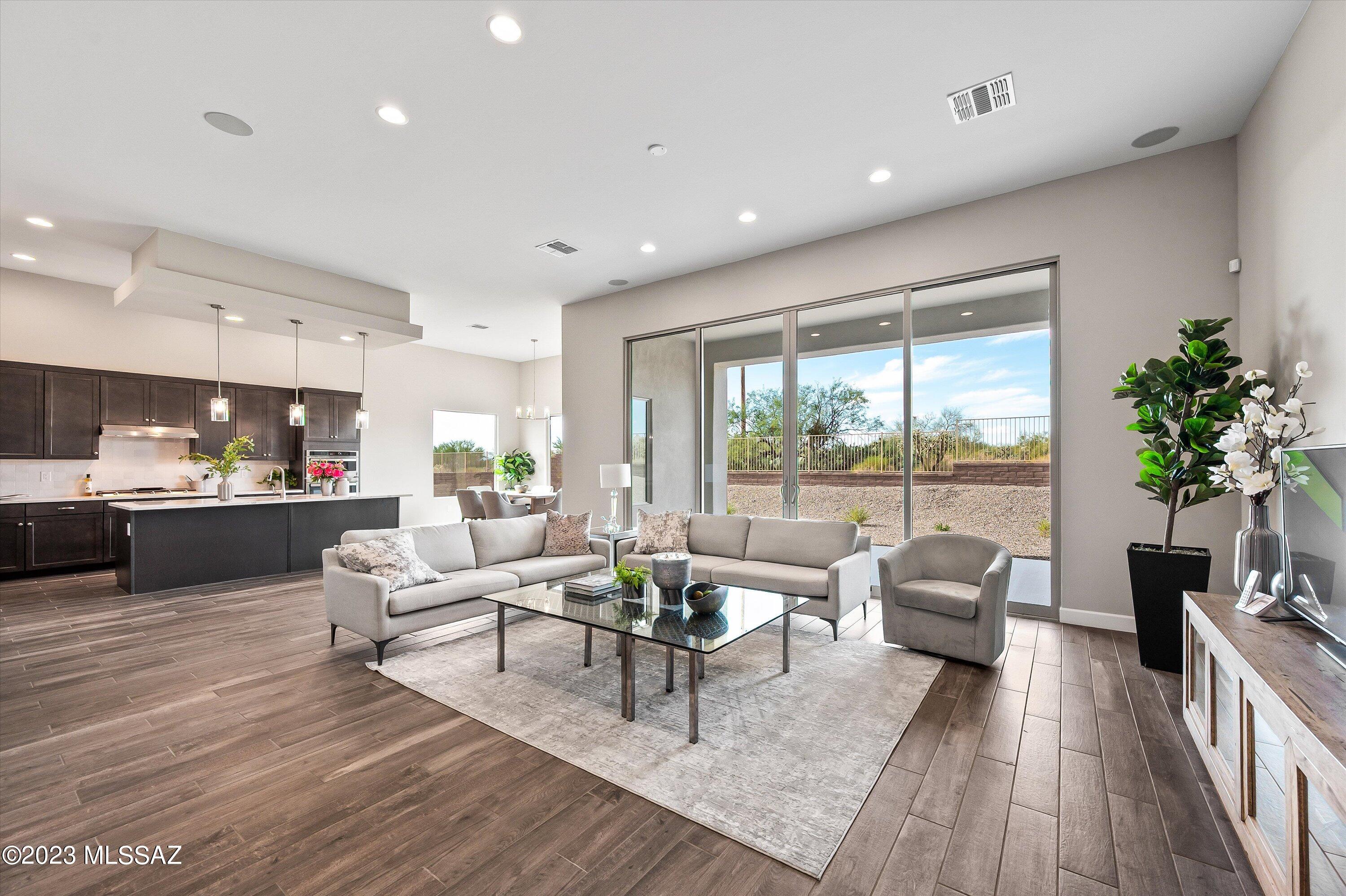 13169 North Vistoso Rnch Place Oro Valley, AZ 85755 - Photo 1 of 29 a living room with furniture and a large window