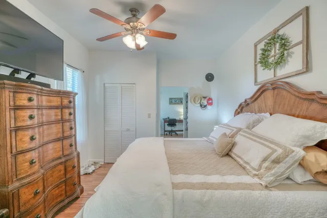 a bedroom with a bed and a chandelier