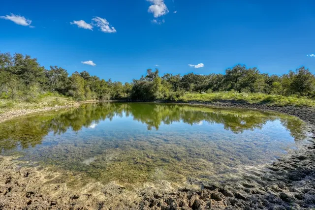 a view of a lake with a big yard