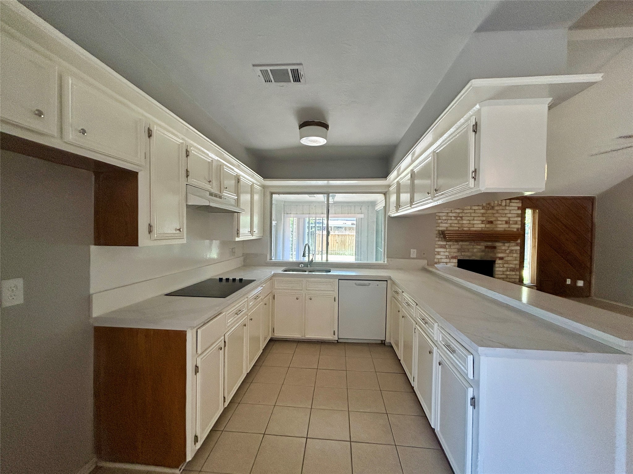 2510 Knollbrook Lane Spring, TX 77373 - Photo 12 of 24 a large white kitchen with a stove top oven