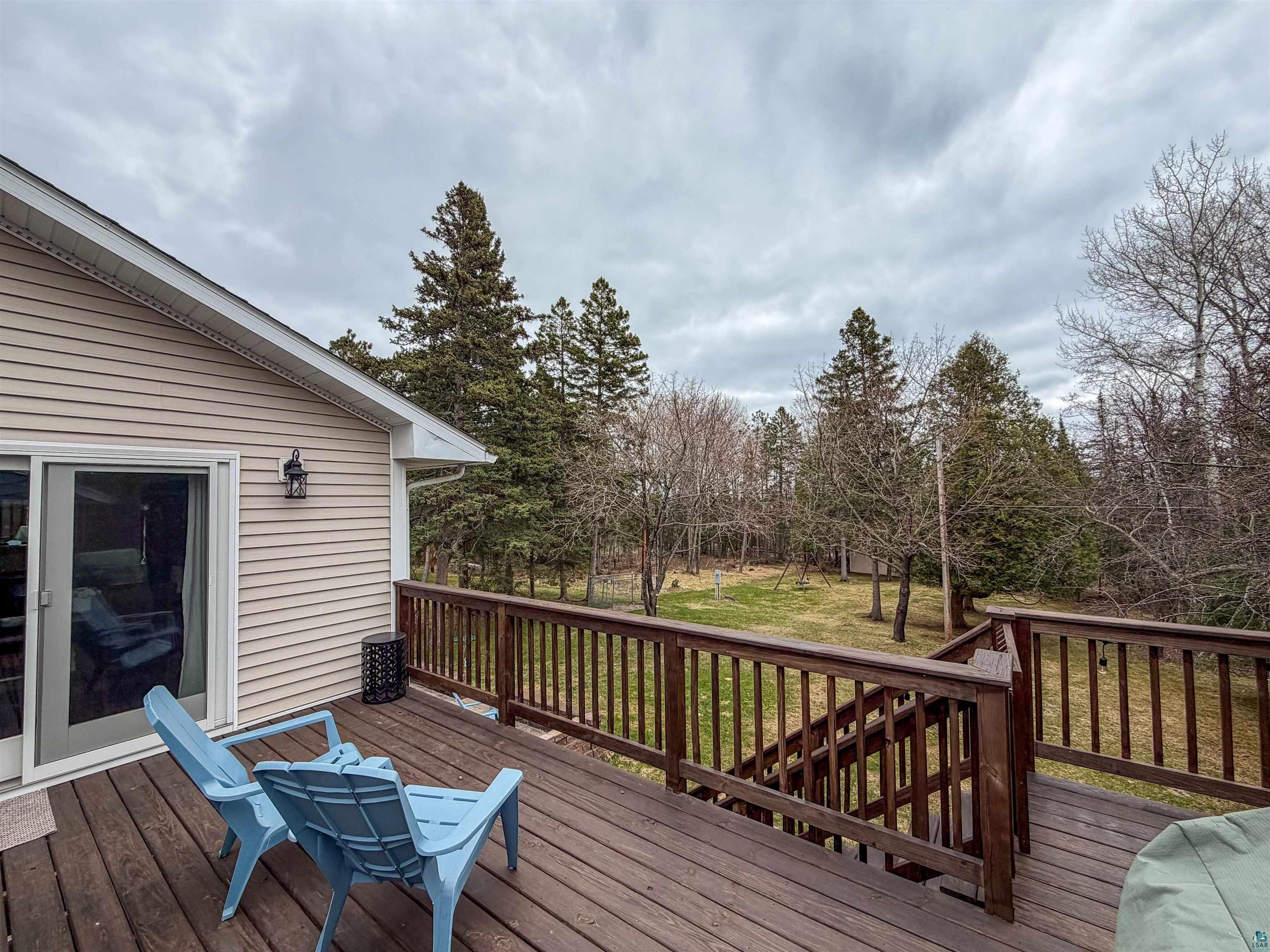 3704 Greysolon Road Duluth, MN 55804 - Photo 39 of 51 Expansive wood-finish deck featuring a full railing system and integrated stairs