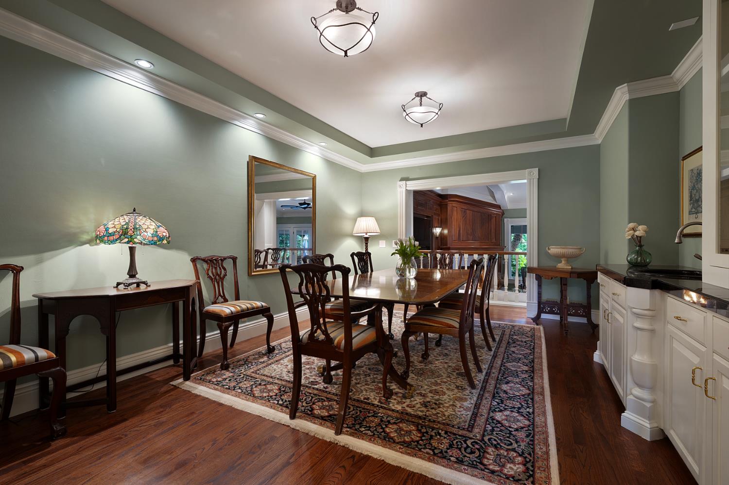 6533 Landis Avenue Carmichael, CA 95608 - Photo 22 of 77 This inviting private dining room offers generous space for entertaining, comfortably accommodating up to 12 guests. The dining table and chairs are included in the sale, and the table features additional leaves, making it easy to expand for larger gatherings.