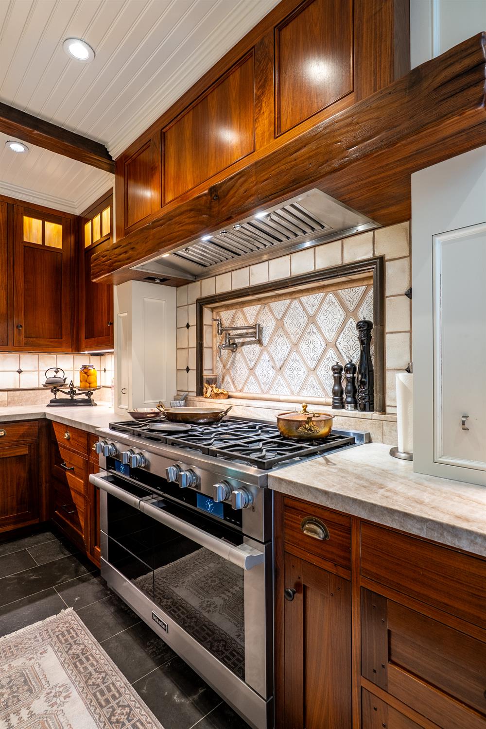 6533 Landis Avenue Carmichael, CA 95608 - Photo 28 of 77 Possibilities are endless with this 8-burner Miele range, which includes double ovens. The commercial grade vent has a custom hand newn walnut hood.