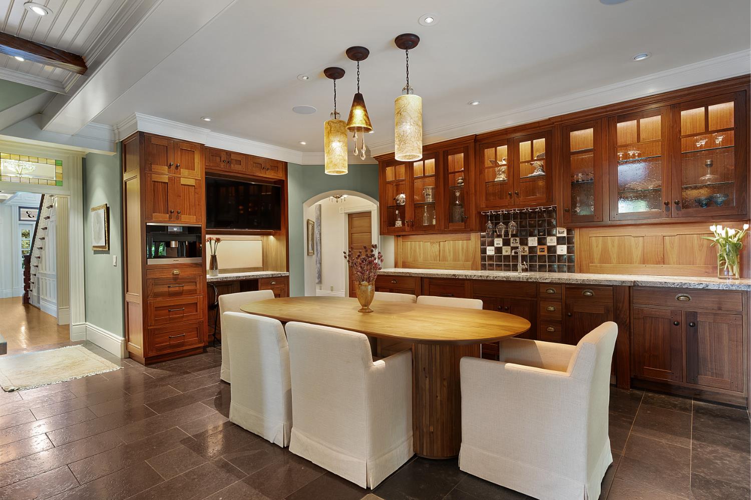 6533 Landis Avenue Carmichael, CA 95608 - Photo 31 of 77 Enjoy meals and celebrations around this informal dining table. Lighted cabinets, a wetbar sink and plenty of storage makes this a warm and inviting space beautiful and functional. Flooring here is slate tiles.