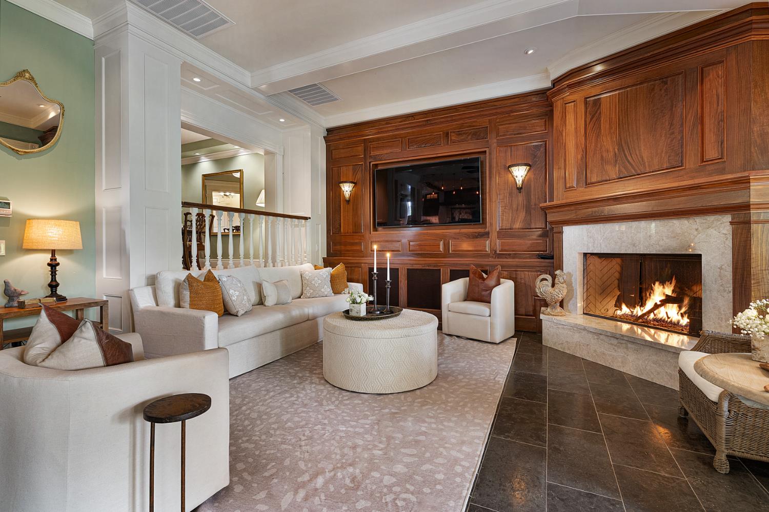 6533 Landis Avenue Carmichael, CA 95608 - Photo 34 of 77 Elegant floor to ceiling quartersawn Walnut paneling is a rare embellishment. It beautifully ties the kitchen and bar together, adding visual cohesiveness. This space is rich, warm and inviting. This gas fireplace is one of 4 fireplaces at the property.