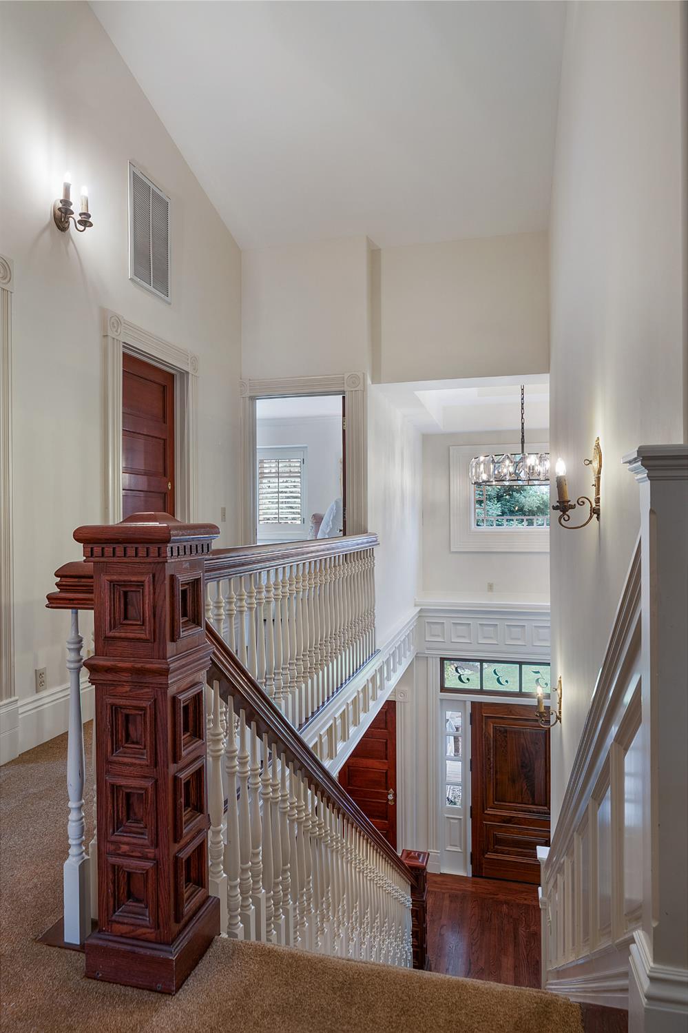 6533 Landis Avenue Carmichael, CA 95608 - Photo 51 of 77 This photo showcases the beautiful and detailed woodworking that is found throughout the house. Note the elegant chandelier in the entrance.