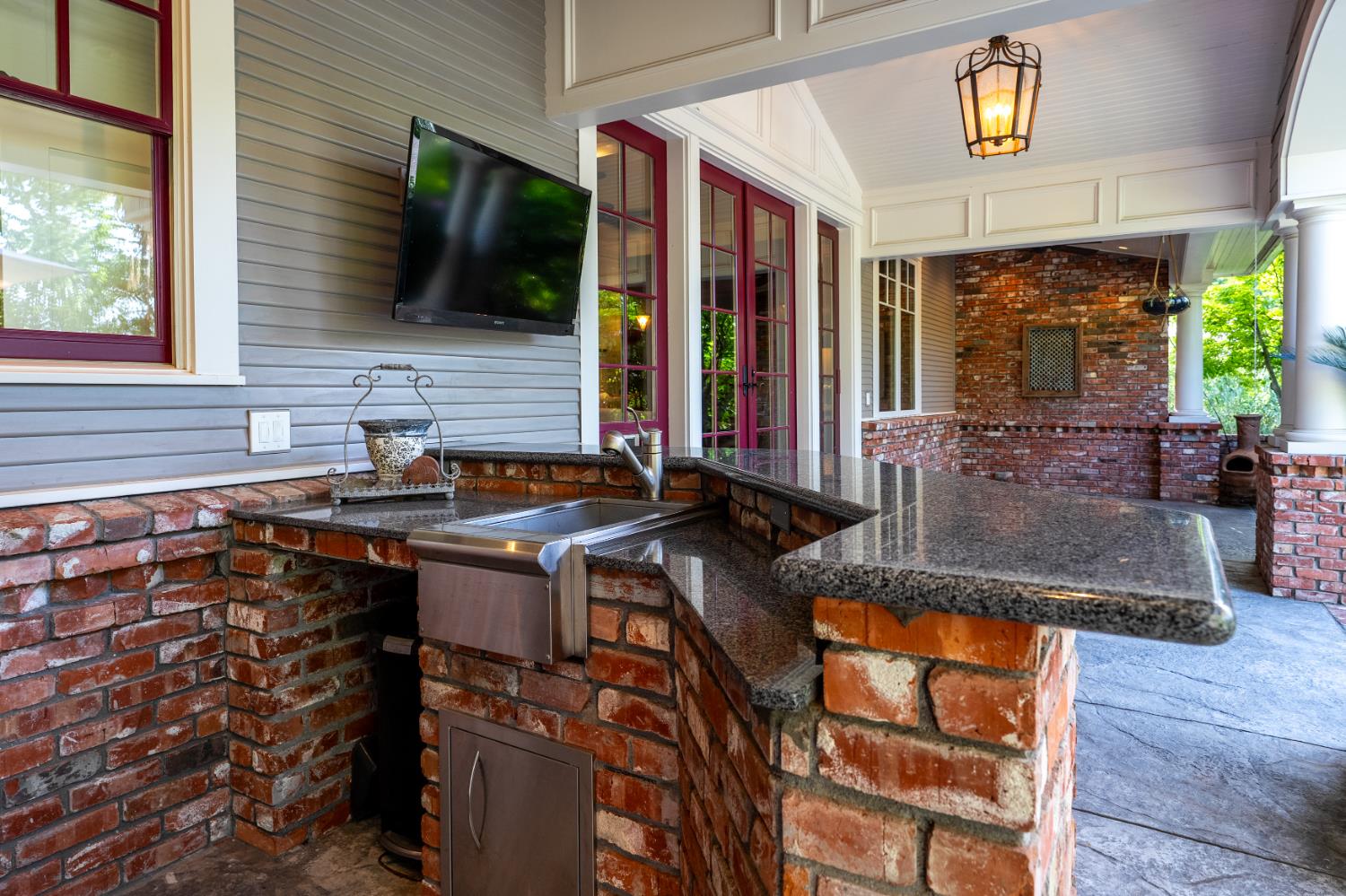6533 Landis Avenue Carmichael, CA 95608 - Photo 60 of 77 Stainless and brick outdoor kitchen. It is located at the back of the house in the covered porch area.