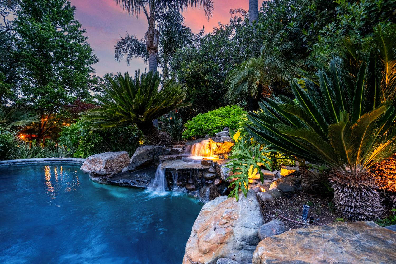6533 Landis Avenue Carmichael, CA 95608 - Photo 9 of 77 This scenic waterfall can be turned on and off remotely, ensuring enjoyment on demand. This is one of two water features in the pool.