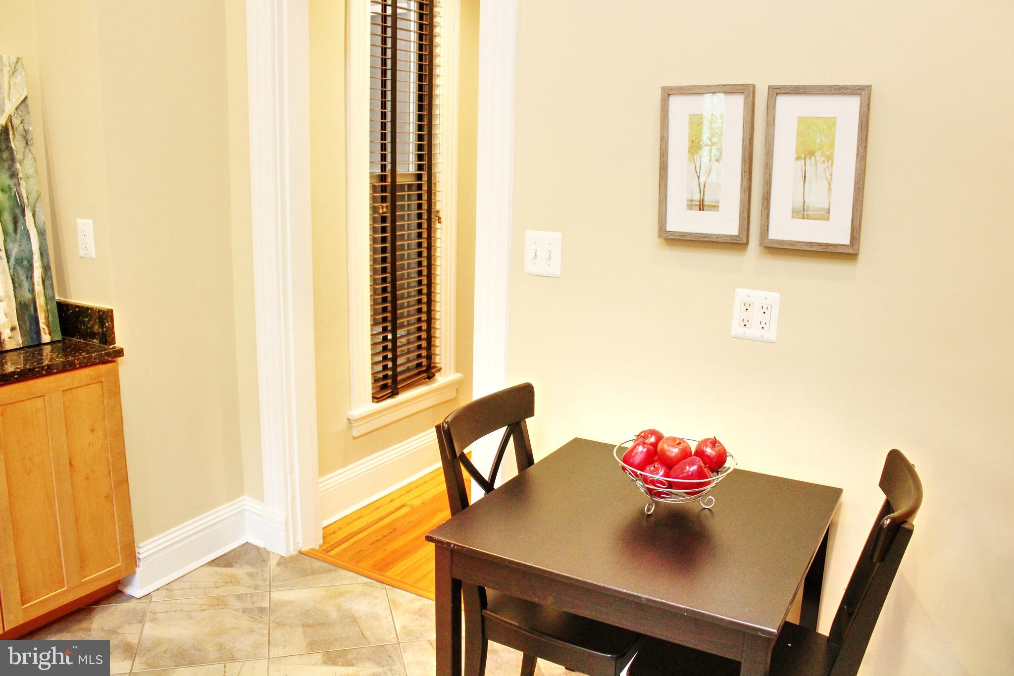 1731 Riggs Place Northwest, Unit 2 Washington, DC 20009 - Photo 19 of 24 a view of a dining room with furniture and a window