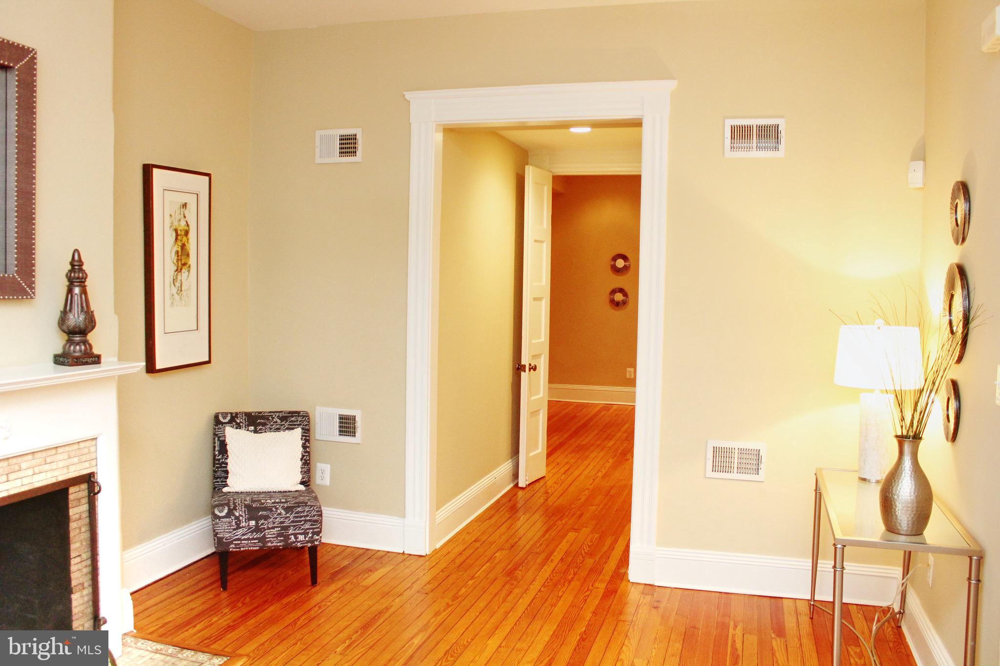 1731 Riggs Place Northwest, Unit 2 Washington, DC 20009 - Photo 5 of 24 a hallway view with furniture and wooden floor