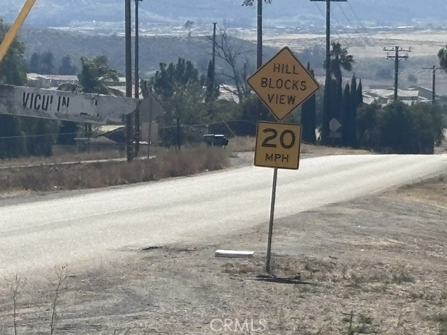 17 Keller Road Winchester, CA 92596 - Photo 14 of 21 a sign that is on the side of the road
