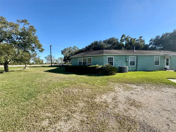 a view of house with garden space and street view