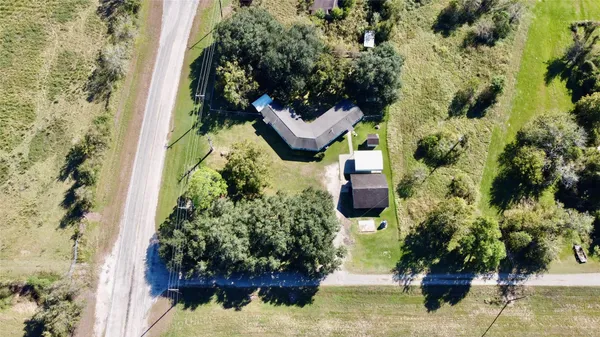 a balcony with lots of trees and flowers