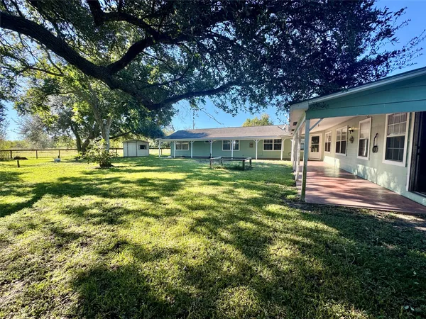 a view of a house with a big yard