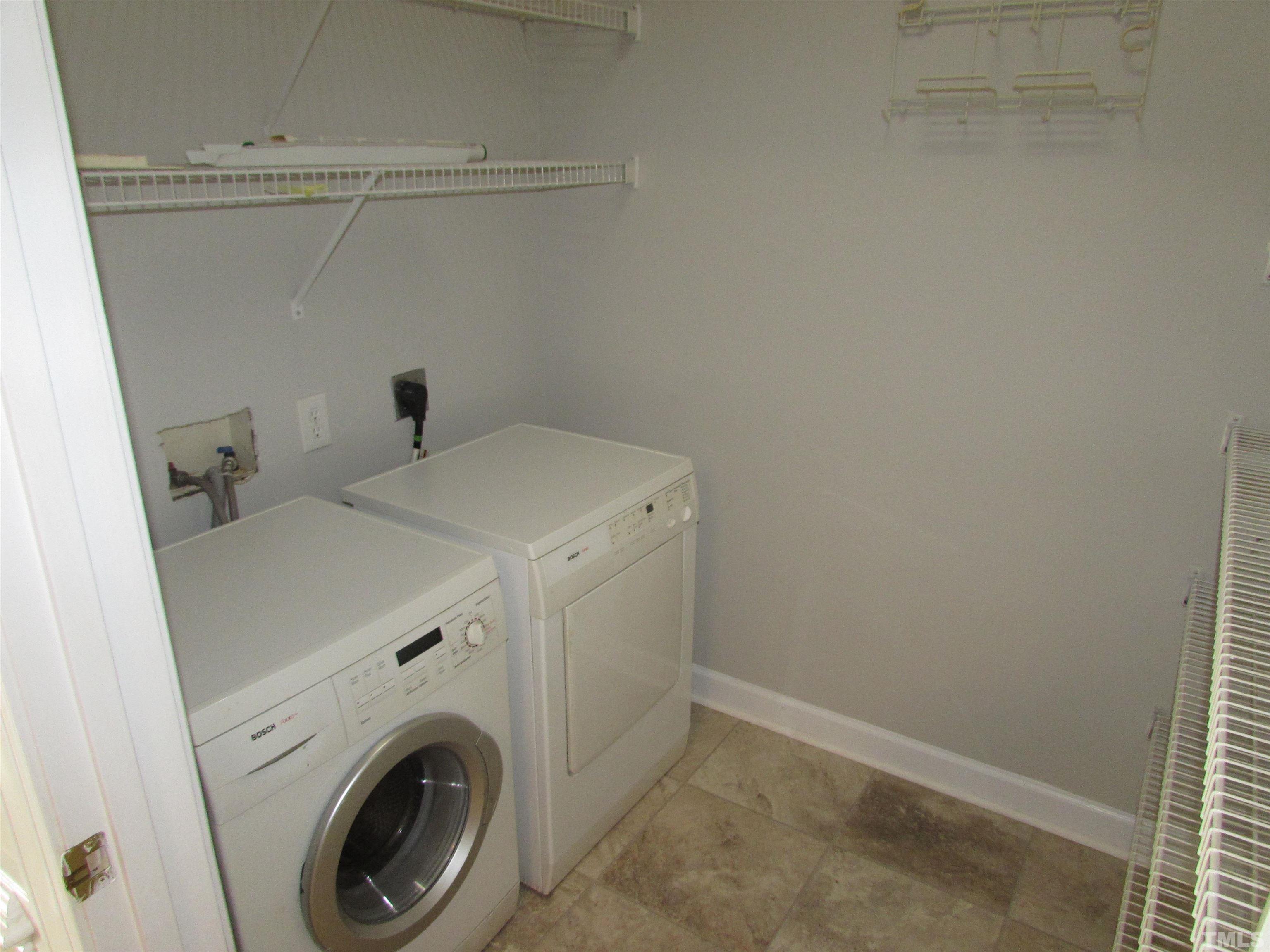 802 Rothshire Court Raleigh, NC 27615 - Photo 15 of 29 a utility room with dryer and washer