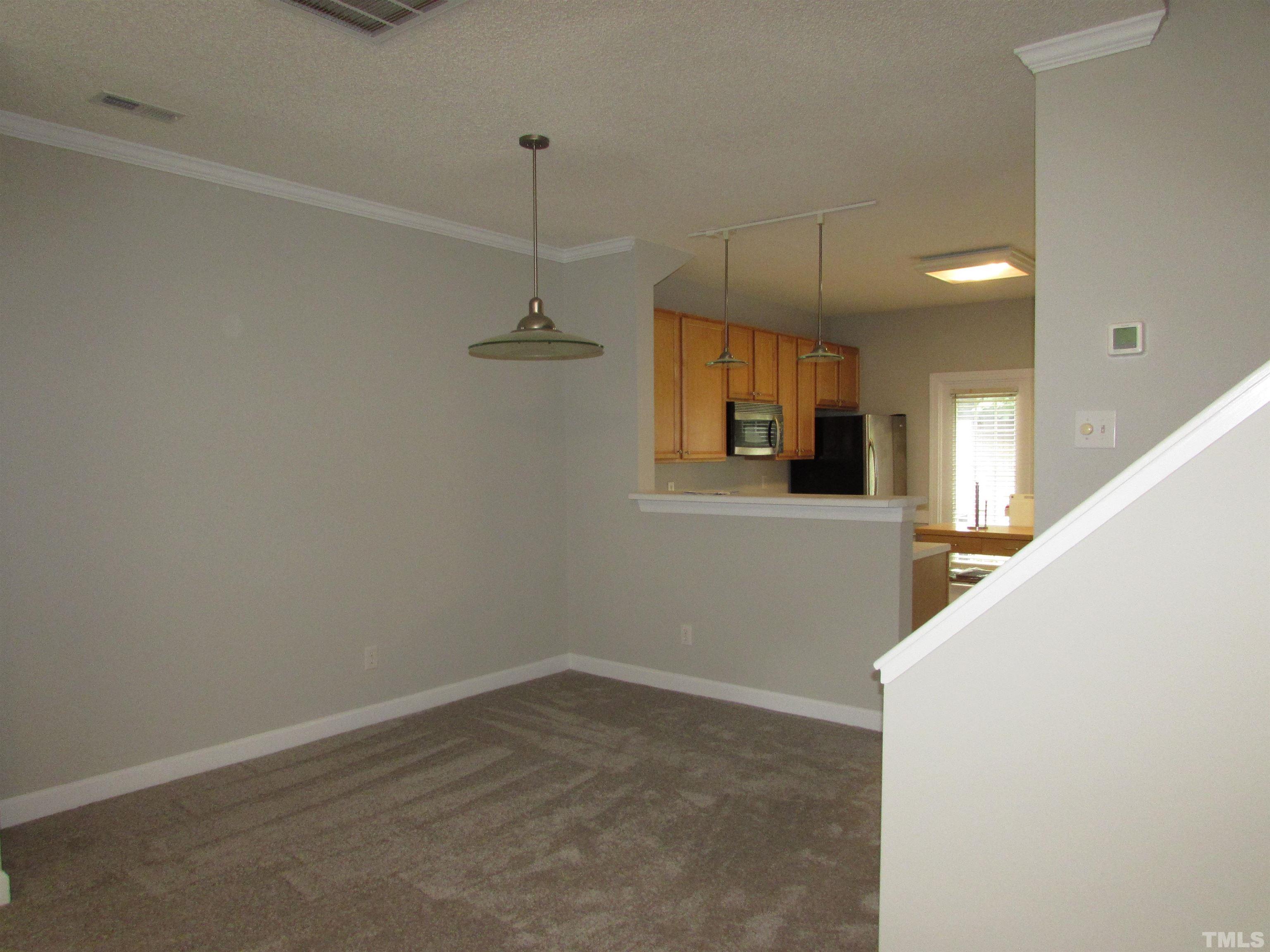 802 Rothshire Court Raleigh, NC 27615 - Photo 7 of 29 a view of a kitchen with a sink and windows