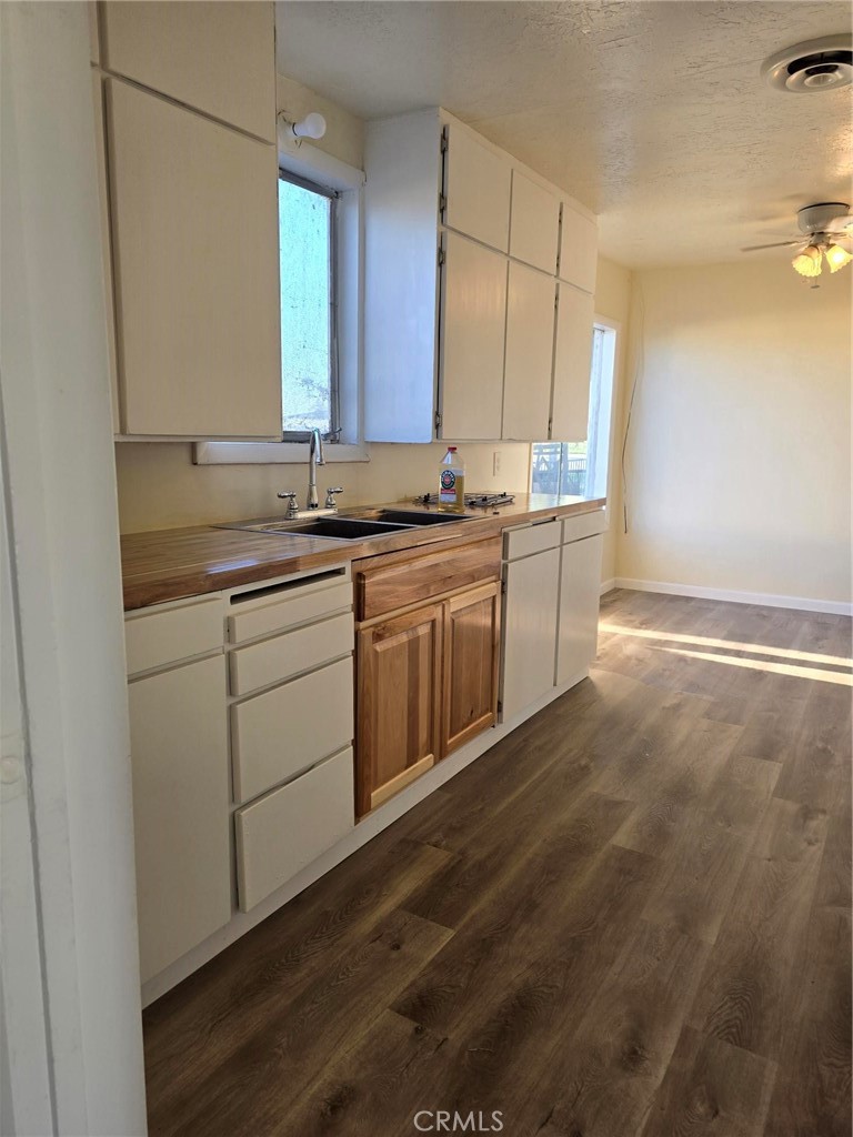 24520 Clark Avenue Orland, CA 95963 - Photo 4 of 13 a kitchen with a sink stove and cabinets