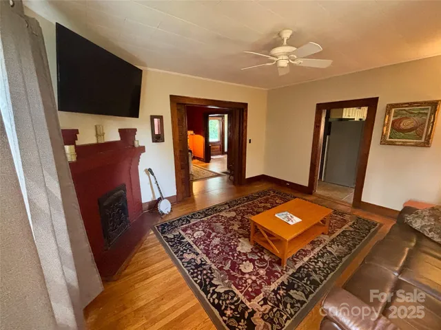 a living room with furniture and a rug