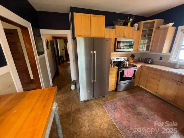 a bed room with a bed and a dresser