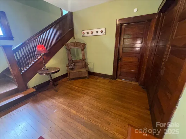 a view of an entryway with wooden floor